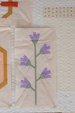 Load image into Gallery viewer, A paper pieced quilt pattern of a wildflower vine with purple flowers on a beige background.