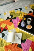 Load image into Gallery viewer, The Weekend Quilter Wind Tunnel Modern Throw Size Quilt in Multi colored Kona Cotton Fabrics on Bed