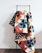 Load image into Gallery viewer, The Weekend Quilter Wind Tunnel Modern Throw Size Quilt in Ruby Star Society Darling Fabrics Hung on Ladder