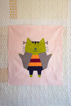 Load image into Gallery viewer, Patchwork quilt square with a colorful cat design on a textured background. The Weekend Quilter Halloween Catwalk Series Frankie Cat Mini Quilt Pattern