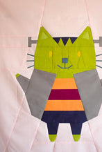 Load image into Gallery viewer, Colorful geometric cat design on a light pink background. The Weekend Quilter Halloween Catwalk Series Frankie Cat Mini Quilt Pattern
