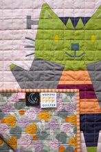 Load image into Gallery viewer, Quilt with a cat design featuring a &#39;Weekend Quilter&#39; label. The Weekend Quilter Halloween Catwalk Series Frankie Cat Mini Quilt Pattern