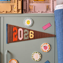 Load image into Gallery viewer, sage green Filing cabinet with decorative magnets and The Weekend Quilter foundation paper pieced 2026 milestone pennant flag.