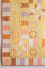 Load image into Gallery viewer, Midnight Medallion quilt with star and block patterns on a yellow background