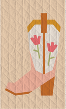 Load image into Gallery viewer, Blushing Boot foundation paper pieced quilt block by The Weekend Quilter, featuring a modern pink and orange cowboy boot with tulip flowers on a soft cream background. Western-themed mini quilt pattern for modern quilters, perfect for wall hangings or incorporating into larger quilt projects. Beginner-friendly FPP design with step-by-step instructions.