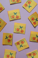 Load image into Gallery viewer, Small yellow cards with orange cherries and text on a purple background