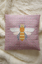Load image into Gallery viewer, Quilted pillow with a bee design on a fluffy white surface. Pollen Gatherer foundation paper pieced (FPP) quilt block designed by The Weekend Quilter.  fabrics all from the GeoBloom Fabric collection for AGF 